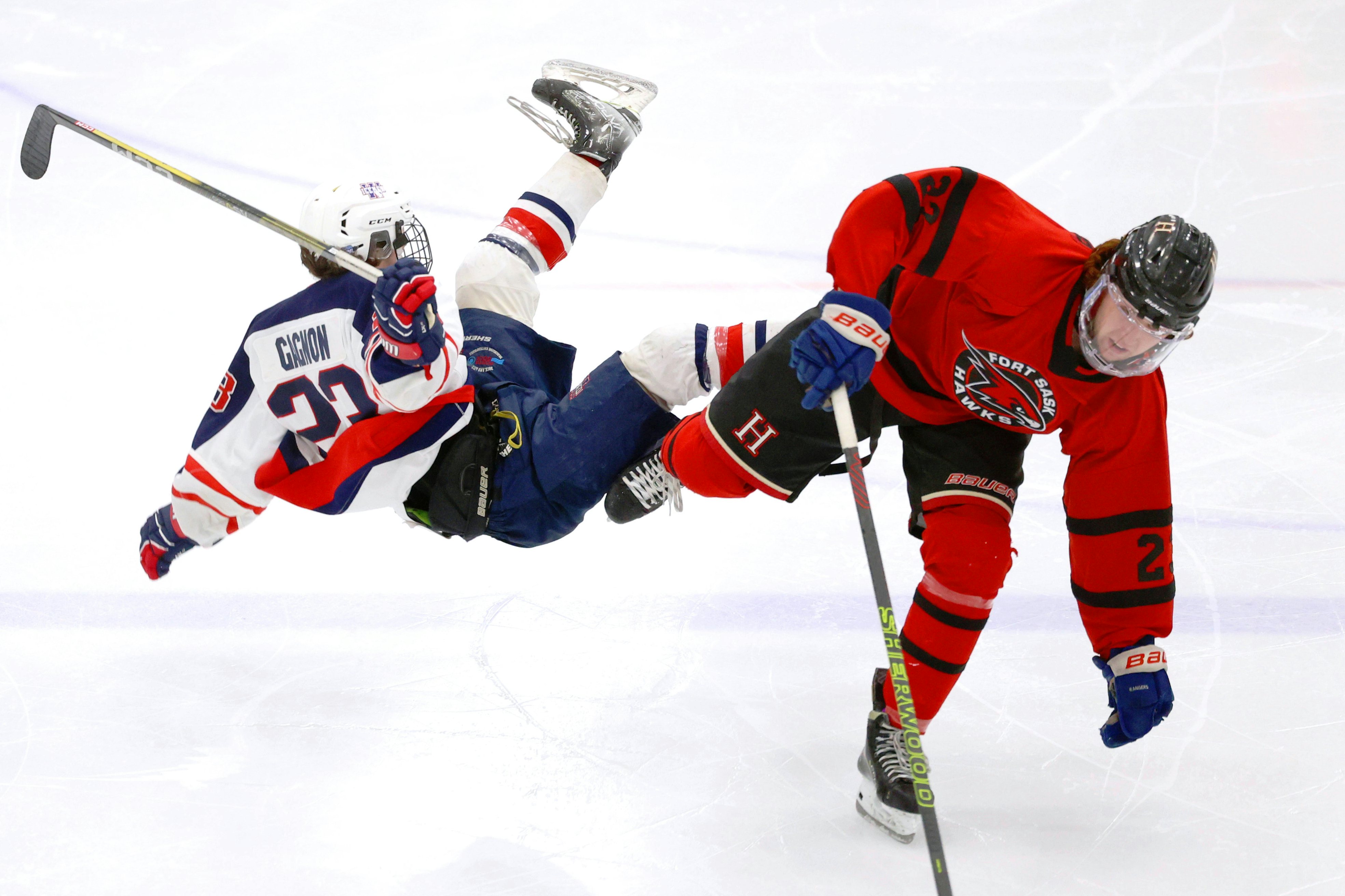 FORT SASKATCHEWAN, AB - February 4: Wetaskiwin Icemen forward Josh Gagnon #23 collides with Chase Boettger #22 of the Fort Saskatchewan Hawks during Capital Junior Hockey League play at the Dow Centennial Centre in Fort Saskatchewan, AB on February 4th, 2024. (Photo by James Maclennan)