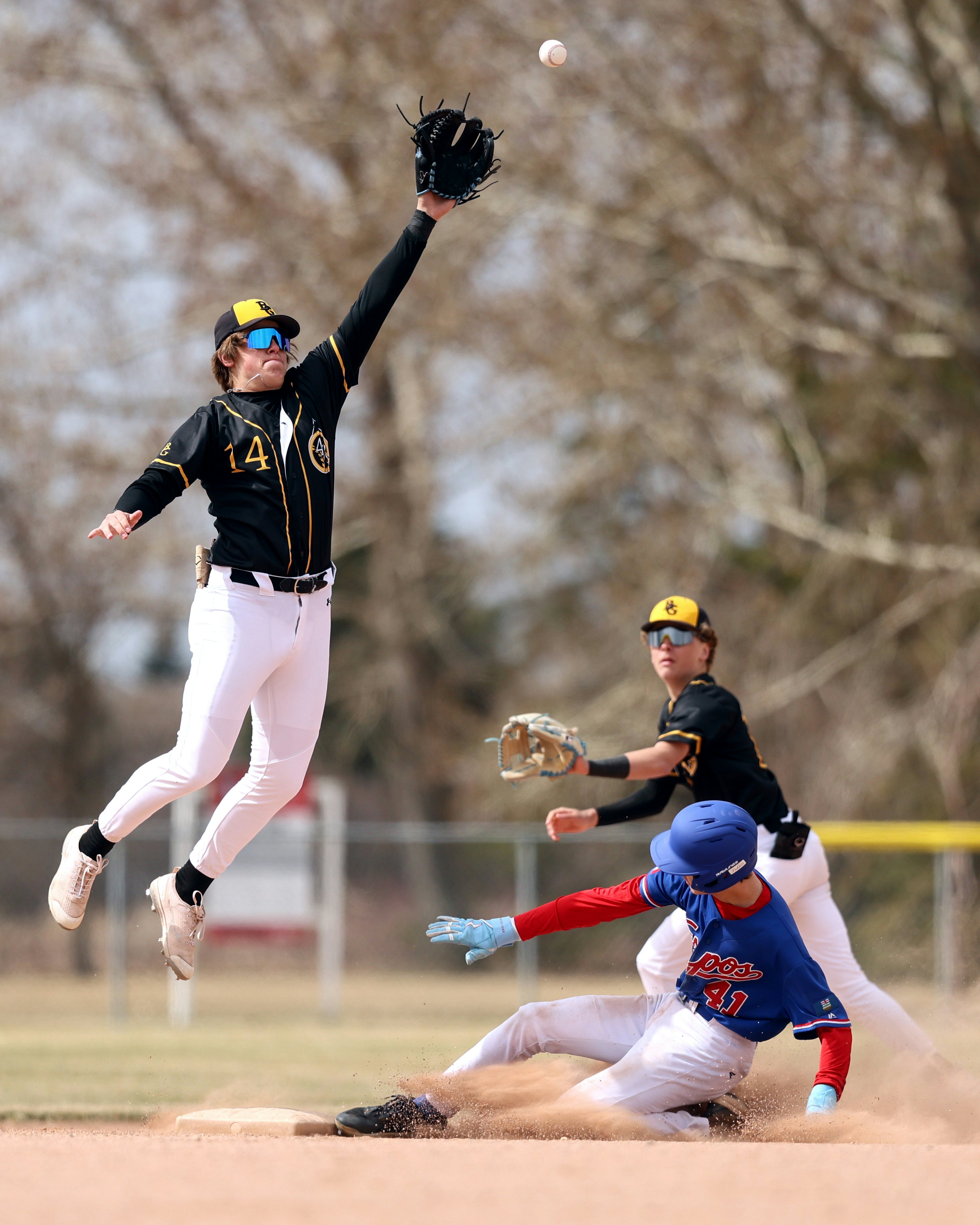 LEDUC, AB - April 28: Aidan Marshall #14 of the Black Gold 47's attempts to catch an overthrown ball at second base against the Edmonton Expos 18UAAA at Fred Johns Park in Leduc, AB on April 28, 2024. (Photo by James Maclennan)